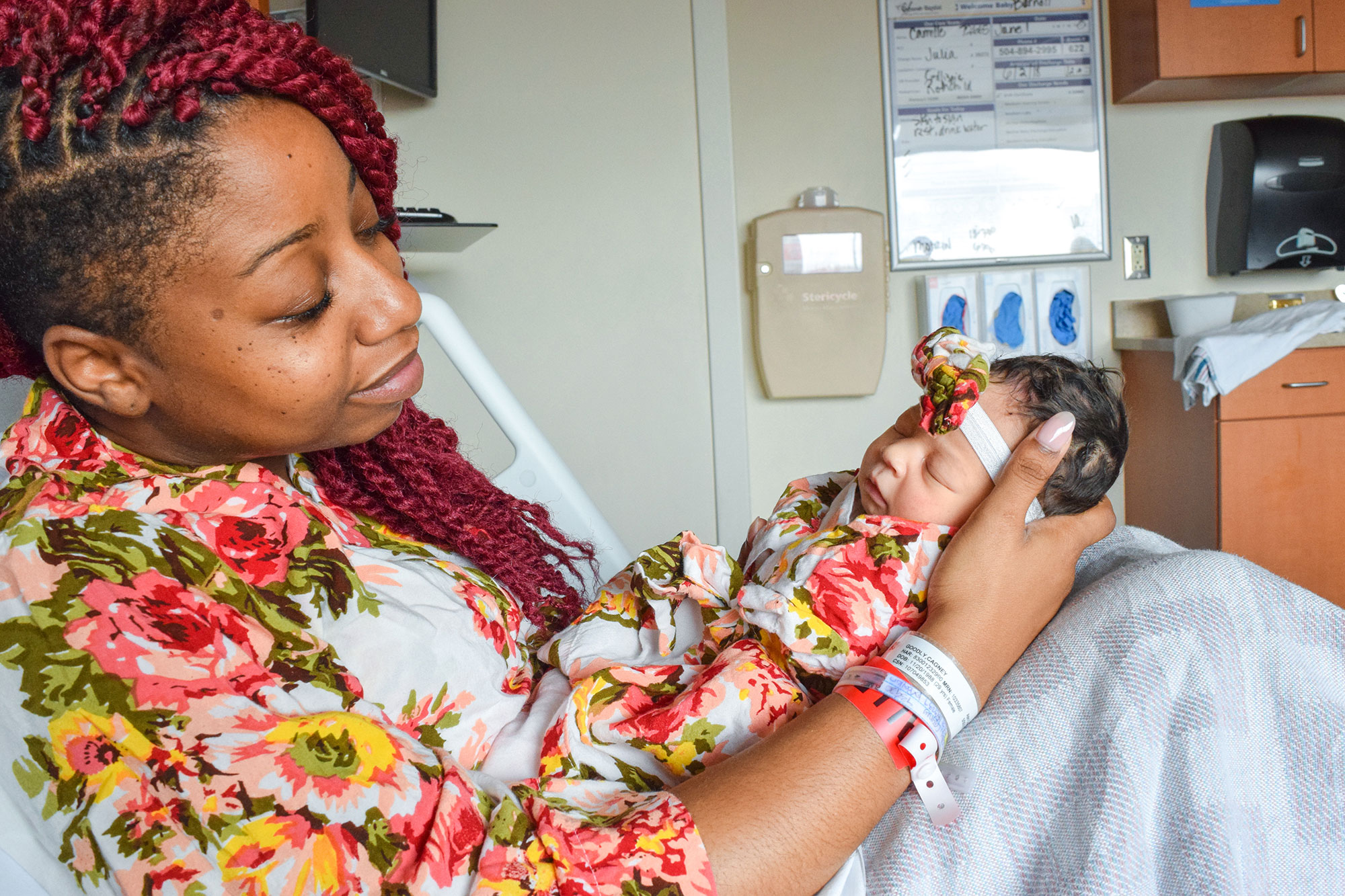 Cagney Goodly holding her newborn daughter